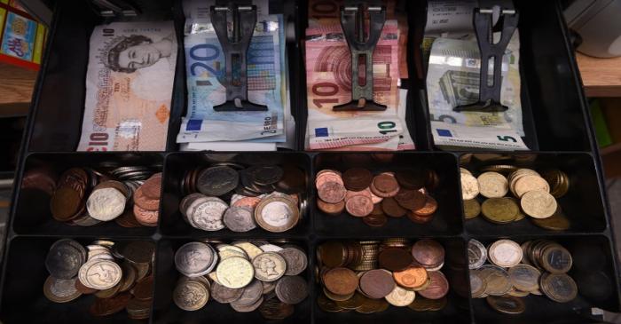 A shop cash register is seen with both Sterling and Euro currency in the till at the border