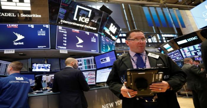 Traders work on the floor of the New York Stock Exchange, (NYSE) in New York