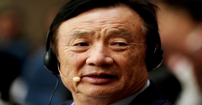 FILE PHOTO: Huawei founder Ren Zhengfei attends a panel discussion at the company headquarters