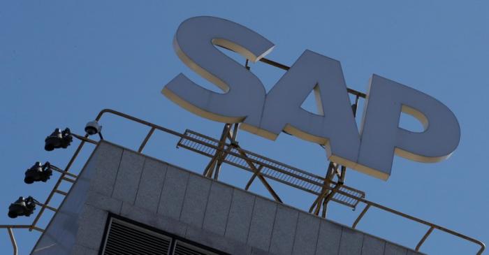 A view shows a sign with the logo of SAP software company on the roof of an office building in