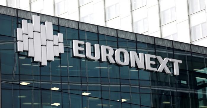 FILE PHOTO: The logo of stock market operator Euronext is seen on a building in the financial