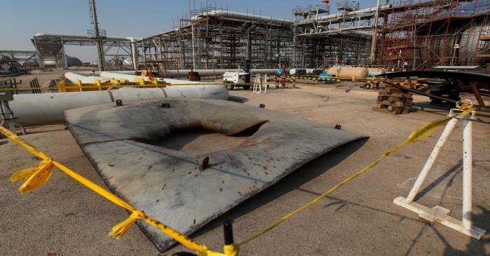 A metal part of a damaged tank is seen at the damaged site of Saudi Aramco oil facility in