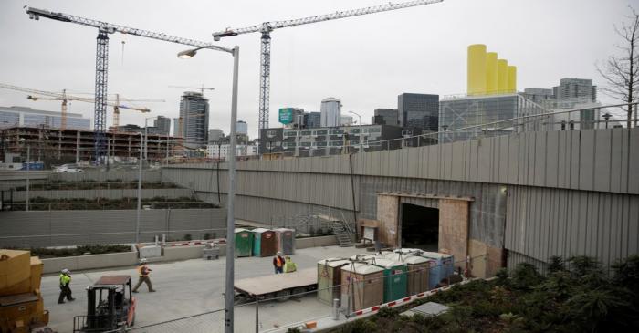 Workers are pictured at the southbound entrance to the double deck State Route 99 highway