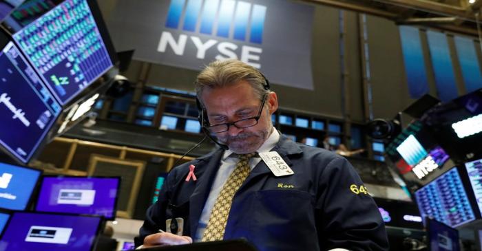 A trader works on the floor at the NYSE in New York