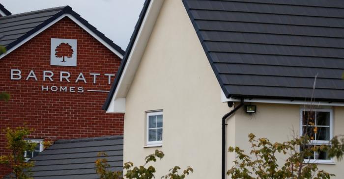 A company logo is seen on the side of a house at a Barratt Homes housing development near