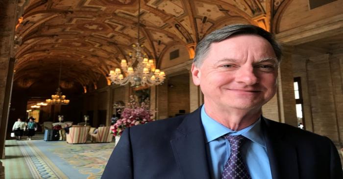 FILE PHOTO: Charles Evans, president of the Federal Reserve Bank of Chicago, poses for a photo