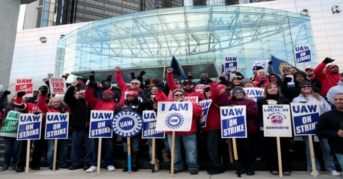 Striking United Auto Workers (UAW) members rally in front of General Motors World headquarters