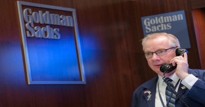 A trader works inside the Goldman Sachs booth on the floor of the  NYSE in New York