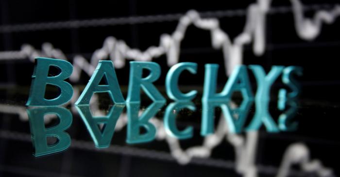The Barclays logo is seen in front of displayed stock graph in this illustration