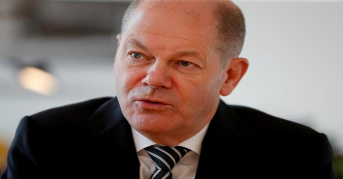 FILE PHOTO: German Finance Minister Olaf Scholz is pictured in his office during an interview