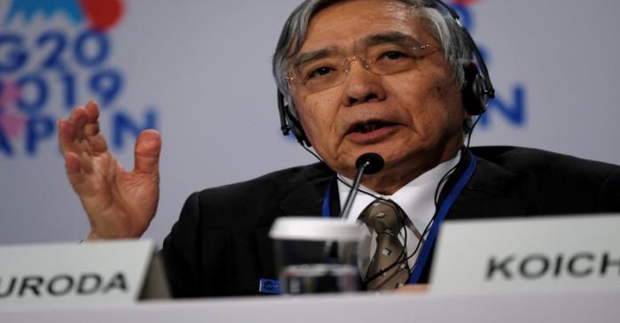 Bank of Japan Governor Haruhiko Kuroda takes questions from reporters at the annual meetings of