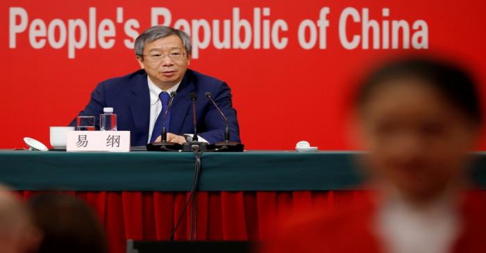 FILE PHOTO: Governor of People's Bank of China (PBOC) Yi Gang attends a news conference on