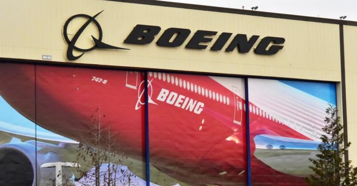 FILE PHOTO: Boeing Co's logo is seen above the front doors of its largest jetliner factory in
