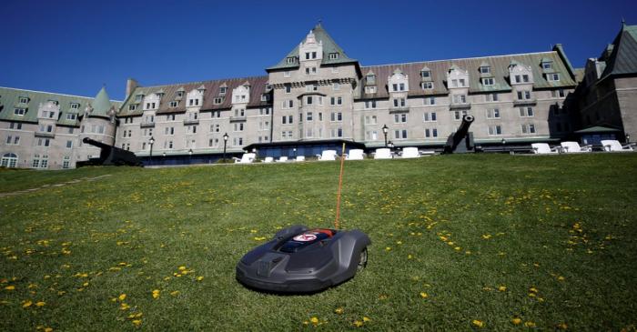 FILE PHOTO: A Husqvarna automower robotic lawn mower cuts grass outside the Manoir Richelieu in