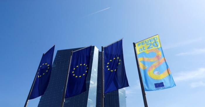 Flags are pictures in front of the European Central Bank (ECB) headquarters in Frankfurt