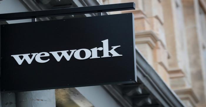 The WeWork logo is displayed outside of a co-working space in New York