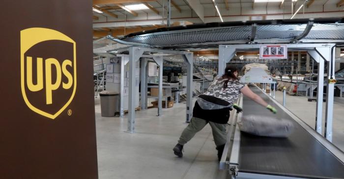 FILE PHOTO: An United Parcel Service employee works at the new package sorting and delivery UPS