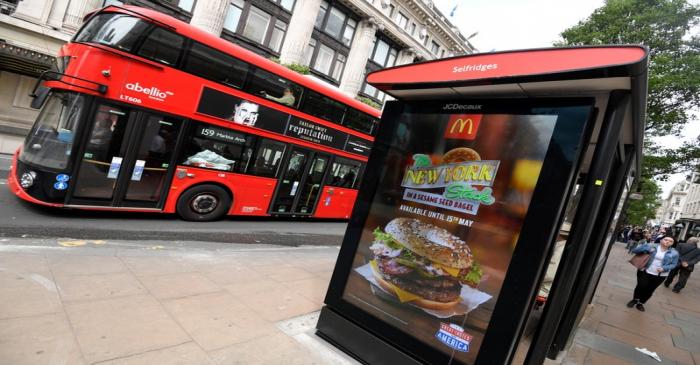 An electronic advertisement for a McDonalds food is seen at a bus stop on Oxford Street in