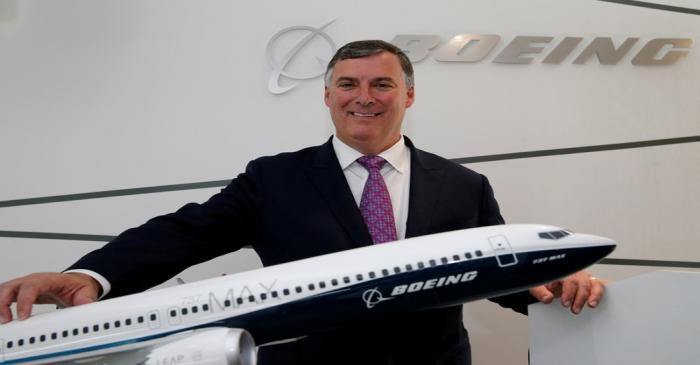 Boeing Commercial Airplanes President, Kevin McAllister poses with a model of 737 MAX 10,