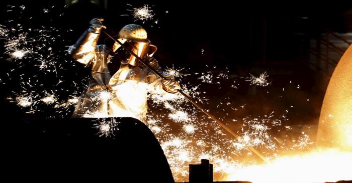 File photo of worker of German steelmaker ThyssenKrupp controling a blast furnace in Duisburg