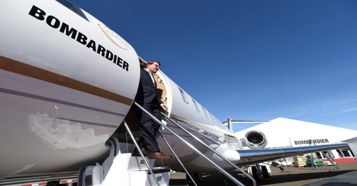 Bombardier Aviation spokesperson Mark Masluch exits the Bombardier Global 6500 business jet at