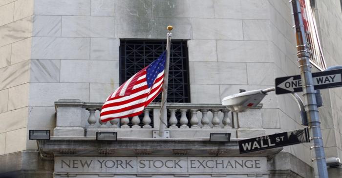 A U.S. flag hangs outside the New York Stock Exchange building