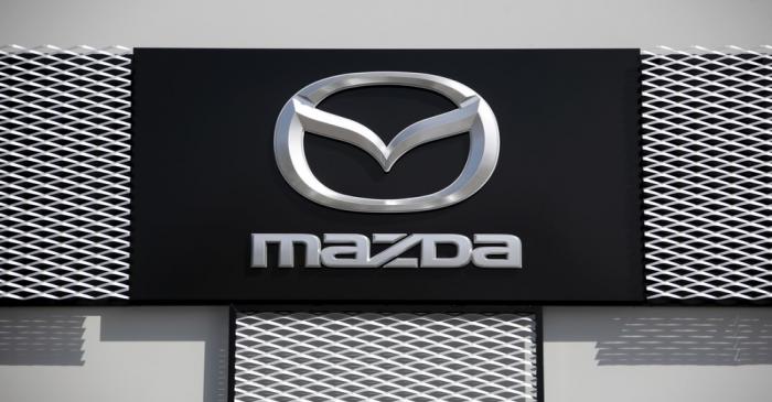 A Mazda company logo is seen outside an automobile dealership inNice