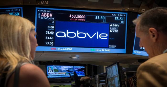 FILE PHOTO: A screen displays the share price for drugmaker AbbVie on the floor of the New York