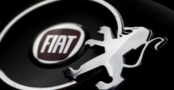 FILE PHOTO: Logos of Peugeot and Fiat are seen in this illustration picture