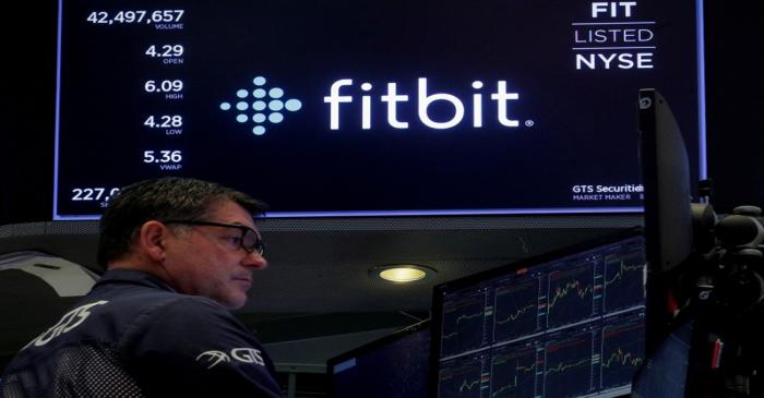 FILE PHOTO: The logo for wearable device maker Fitbit Inc. is displayed on a screen on NYSE
