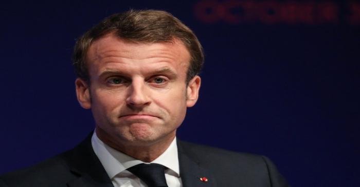 FILE PHOTO: French President Macron attends the Global Forum on AI for Humanity in Paris