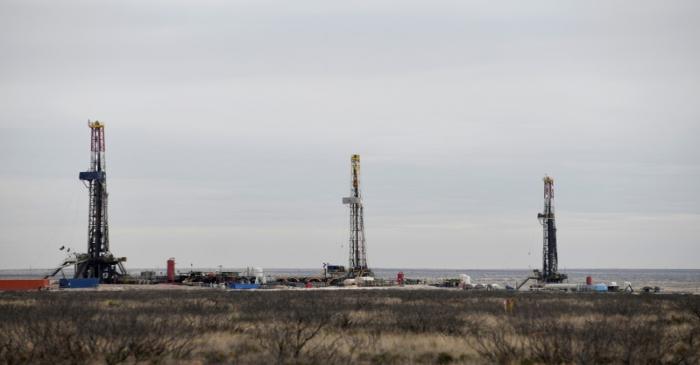 FILE PHOTO: Drilling rigs operate in the Permian Basin oil and natural gas production area in