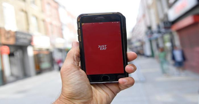 FILE PHOTO: The app for Just Eat is displayed on a smartphone, in London