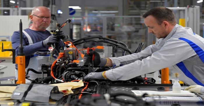 Employees work at a production line of a a new electric Volkswagen model ID.3 in Zwickau