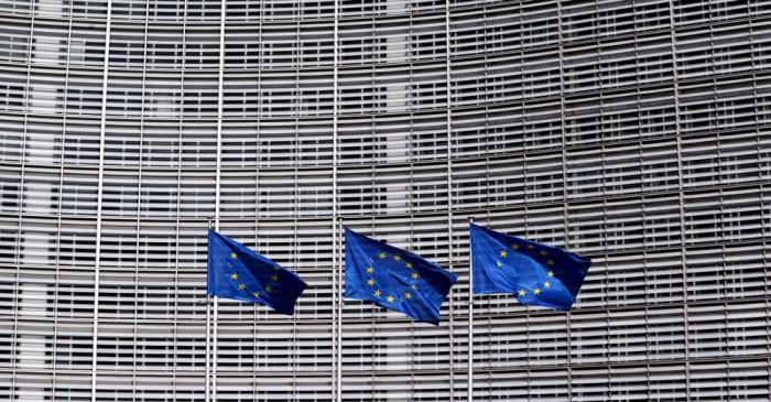 FILE PHOTO: European Union flags fly outside the European Commission headquarters in Brussels