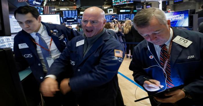 Traders work on the floor at the NYSE in New York