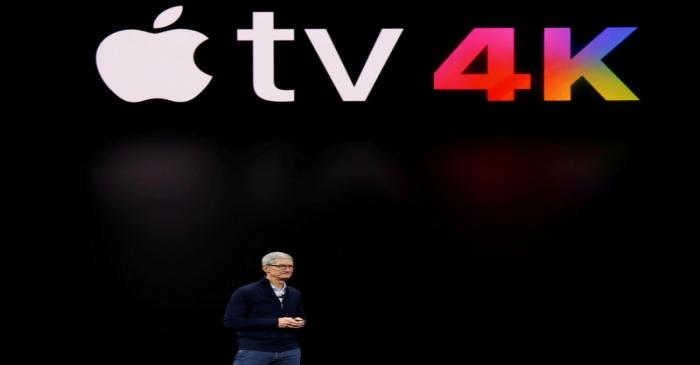 FILE PHOTO: Apple's Tim Cook speaks during a product launch event in Cupertino