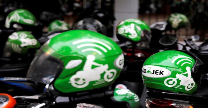 FILE PHOTO - Go-Jek driver helmets are seen during Go-Food festival in Jakarta