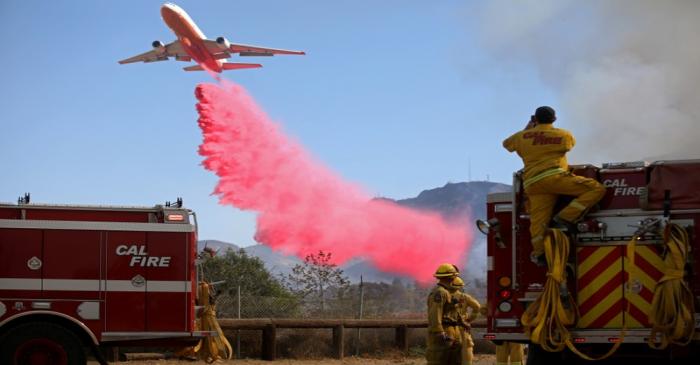 FILE PHOTO: A plane drops fire retardant on the Maria Fire in Santa Paula