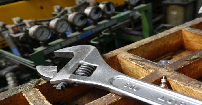 A wrench lies on a workbench at manufacturing firm Sigma UK in Hinckley