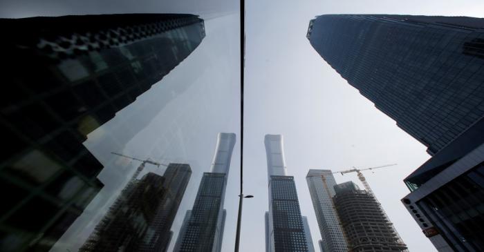 FILE PHOTO: Skyscrapers in the Central Business District (CBD) are reflected in a window in