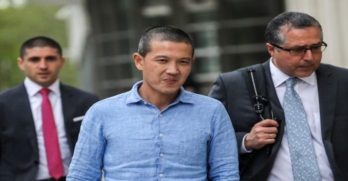 Ex-Goldman Sachs banker Roger Ng and his lawyer Marc Agnifilo leave the federal court in New