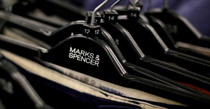 FILE PHOTO: File photo of clothes displayed on hangers in an Marks & Spencer shop in northwest