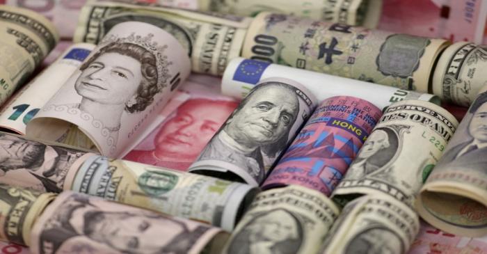 FILE PHOTO: Euro, Hong Kong dollar, U.S. dollar, Japanese yen, British pound and Chinese