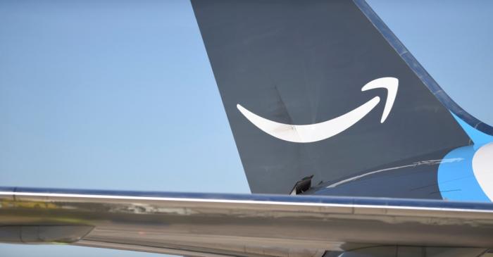 FILE PHOTO: A wide body aircraft emblazoned with Amazon's Prime logo is unloaded at Lehigh