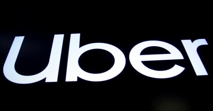 FILE PHOTO: A screen displays the company logo for Uber Technologies Inc. on the day of it's