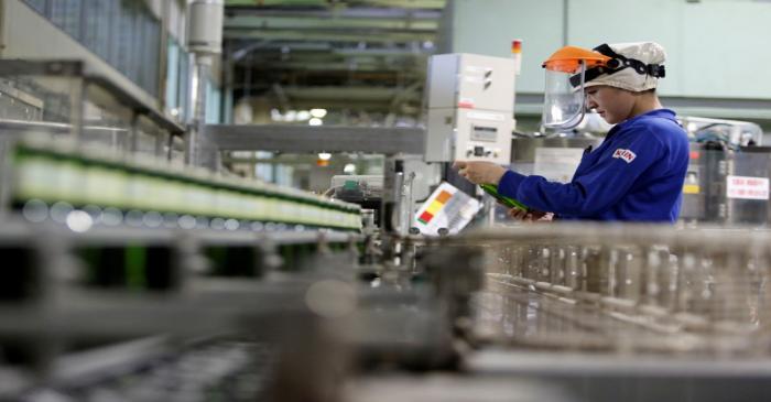 FILE PHOTO: Employee works at Japanese brewer Kirin Holdings' factory in Toride