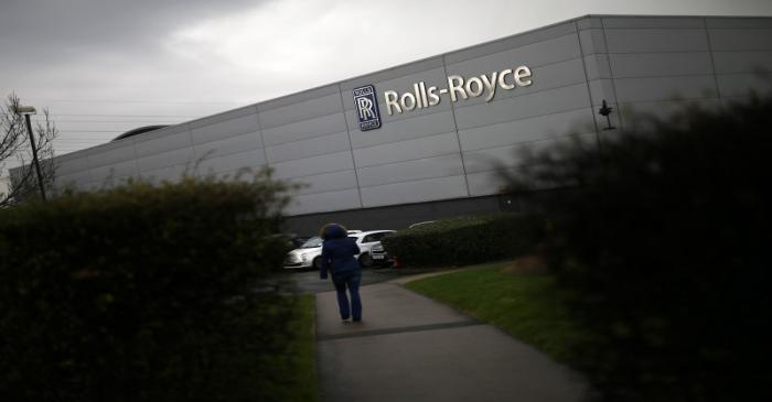 A worker walks into a Rolls Royce site in Derby