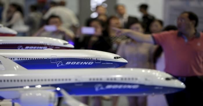 Visitors look at models of Boeing aircrafts at the Aviation Expo China, in Beijing, China