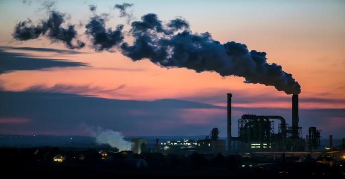 FILE PHOTO: The factory of the company Kronospan is pictured during sunset at the east German